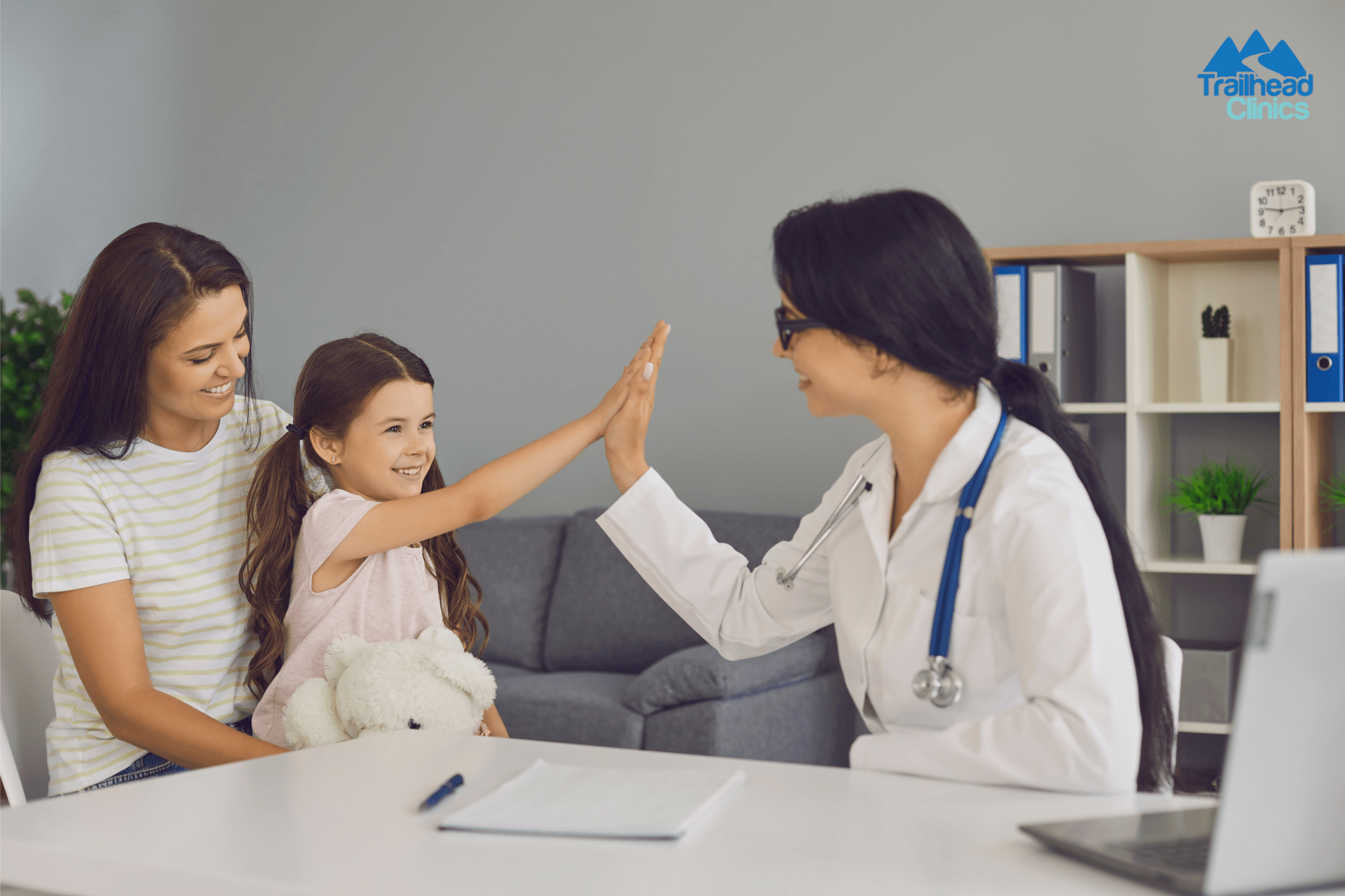 a doctor meeting with a girl and her mother